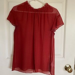 Rust color with small black polka dots